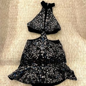 A cute sequined cocktail dress with side cut outs. Perfect for New Years Eve